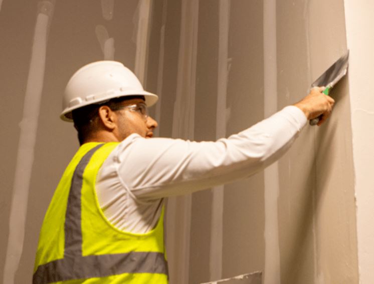 Finish construction workers on interior project