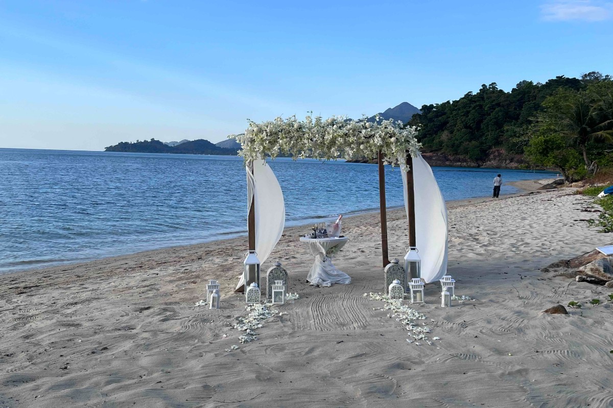 Elegant outdoor wedding ceremony with floral arch