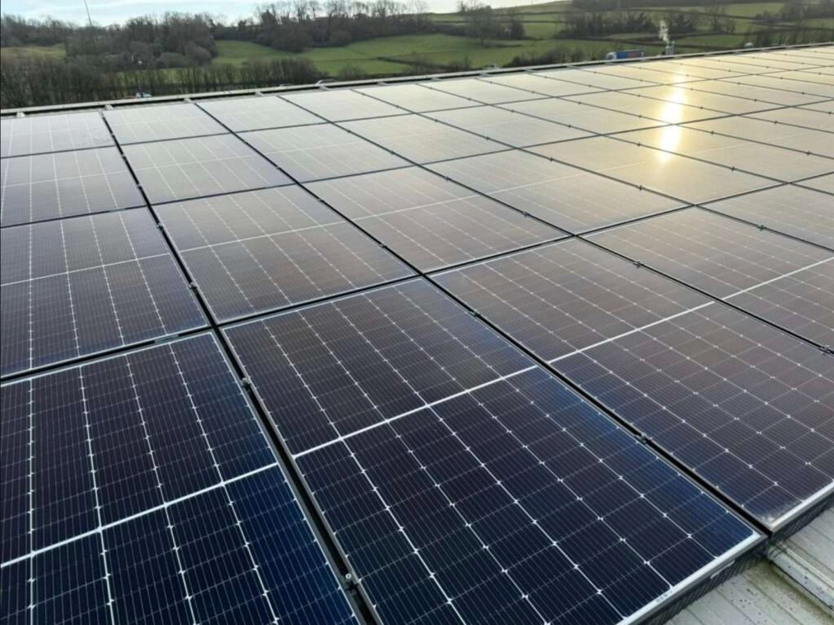 Solar engineer working on a rooftop installation